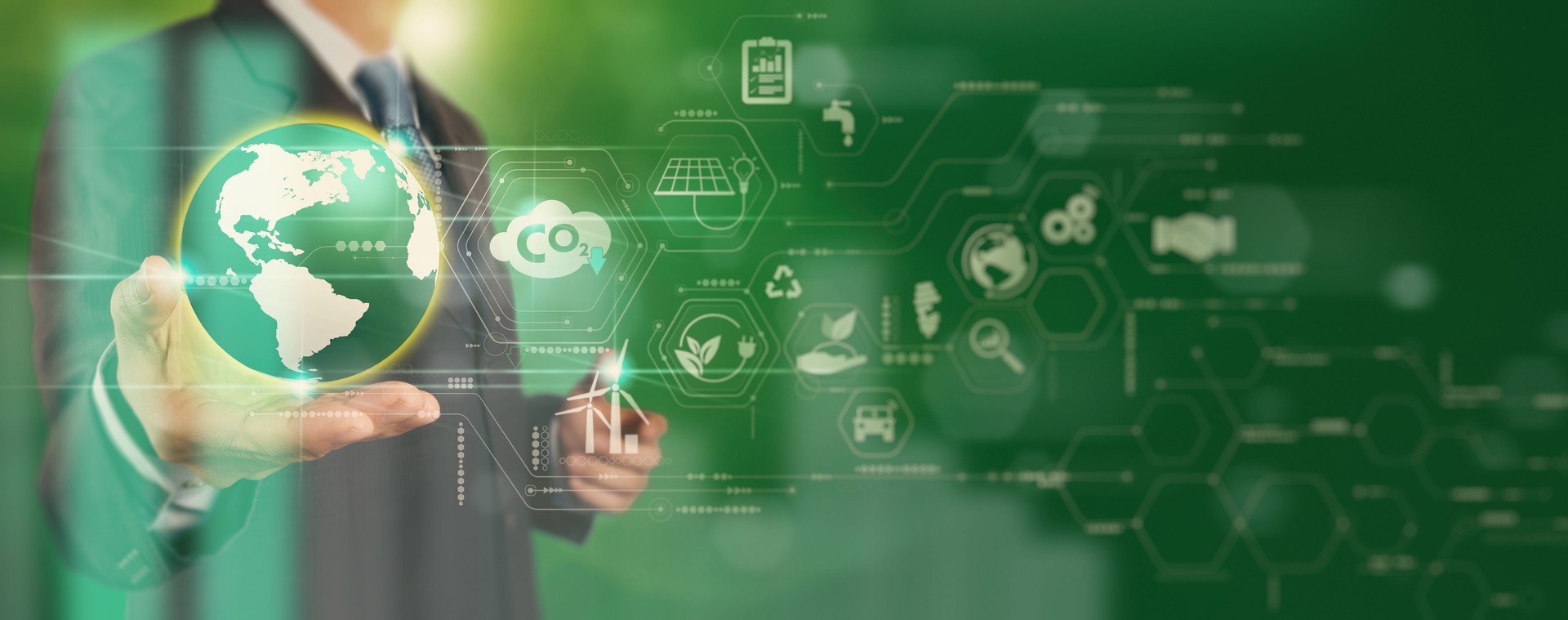 Businessman working virtual globe modern computer to reduce CO2 emissions carbon footprint climate change to limit global warming.Sustainable development and innovation green business concept. Businessman working virtual globe modern computer to reduce CO2 emissions carbon footprint climate change to limit global warming.Sustainable development and innovation green business concept.